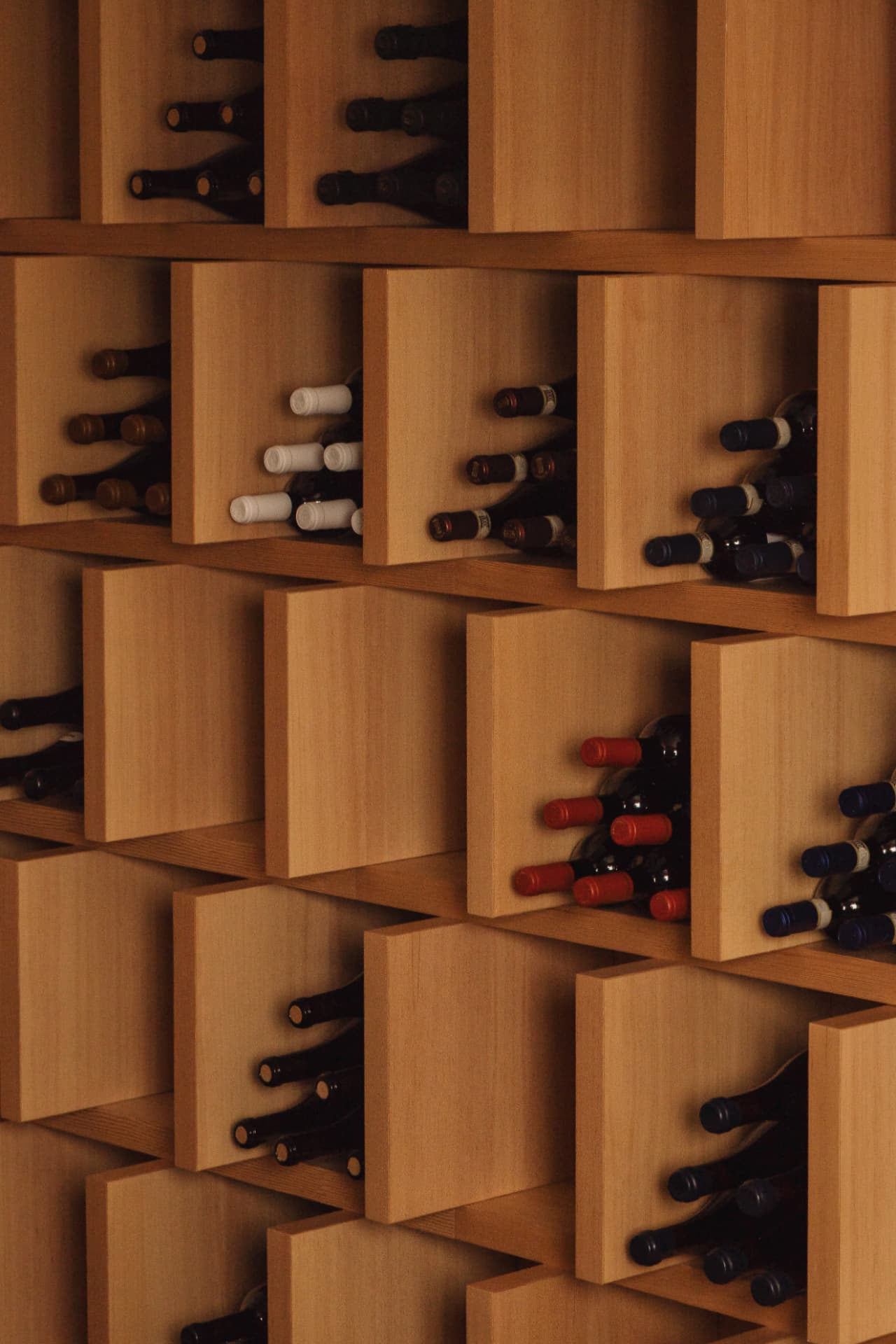 Cubic timber wine storage wall filled with bottles