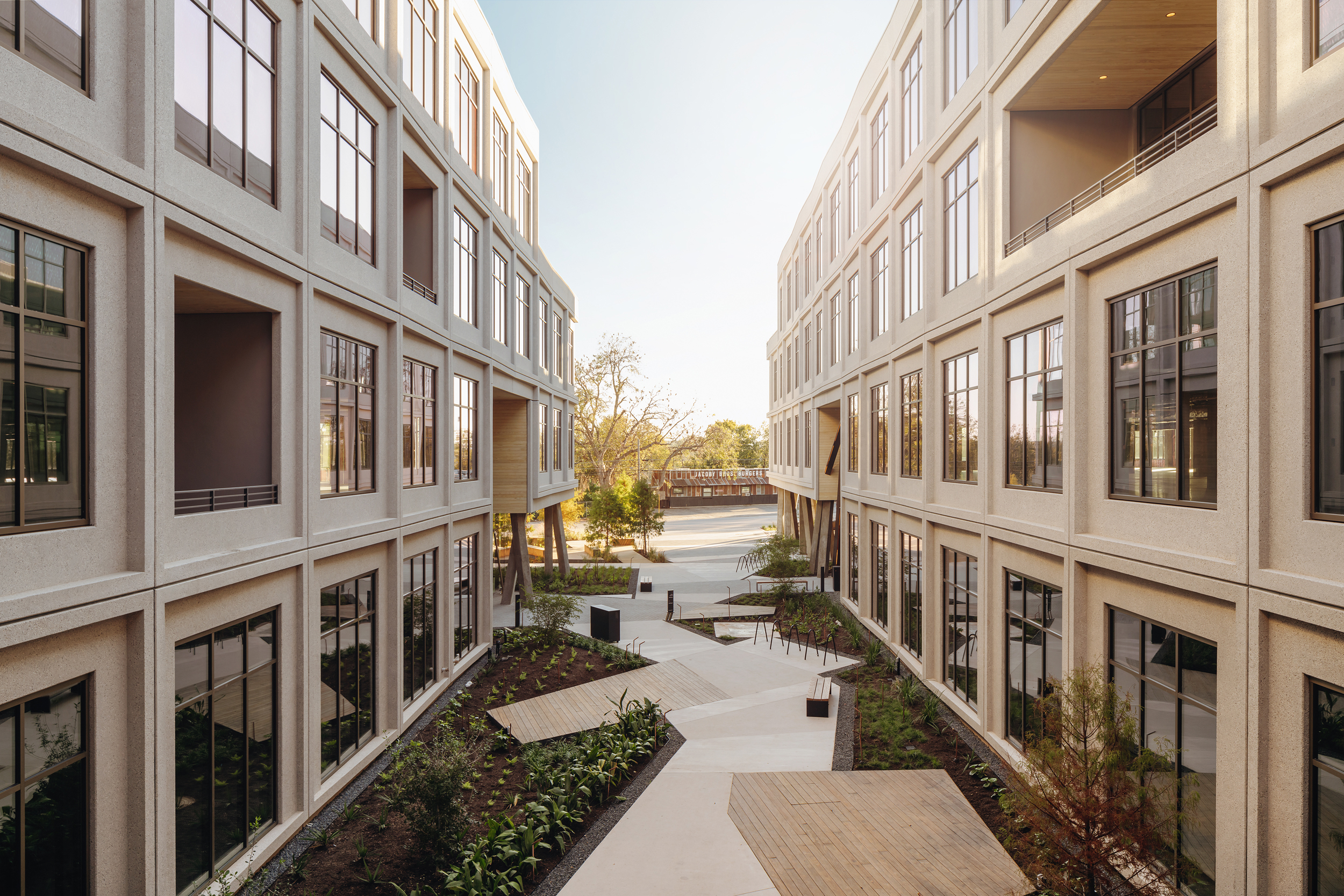 Long view through the landscaped courtyard between two building wings