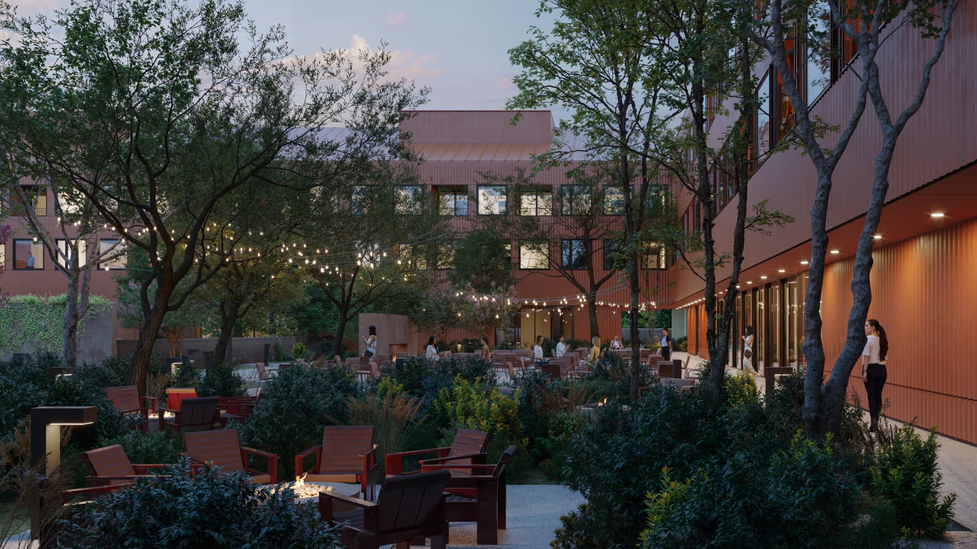 Terrain Hotel courtyard lounge at dusk with string lights, fire pits and dense planting